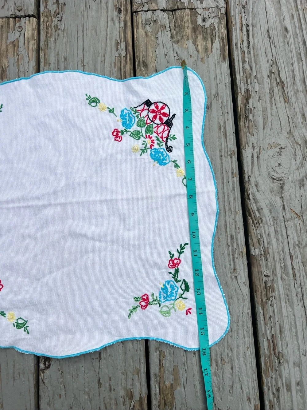 Vintage White Embroidered Table Linen with Blue and Red Floral Accents